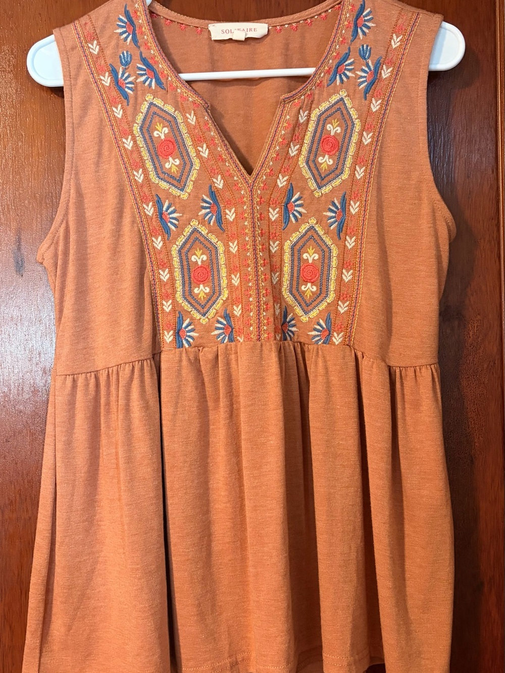 Rust Embroidered Peplum Tunic with Blue and Cream Accents